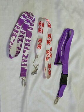 Three identification straps/lineyards/idcords, including one by Joshua Perets